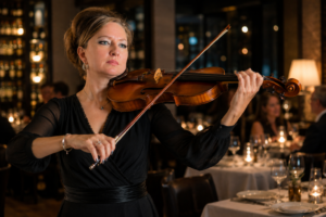 Heather Broadbent – Live Violin Performance Series Heather Broadbent performing live violin at an elegant restaurant in Texas